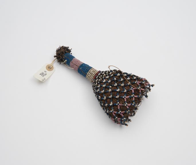 Fibre and beadwork amulet worn by girls