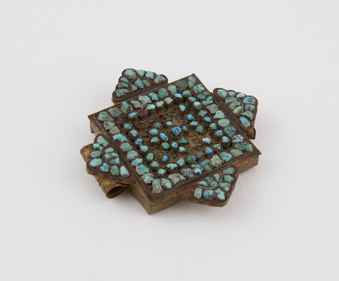 Rectangular amuletic case with turquoise studded projections