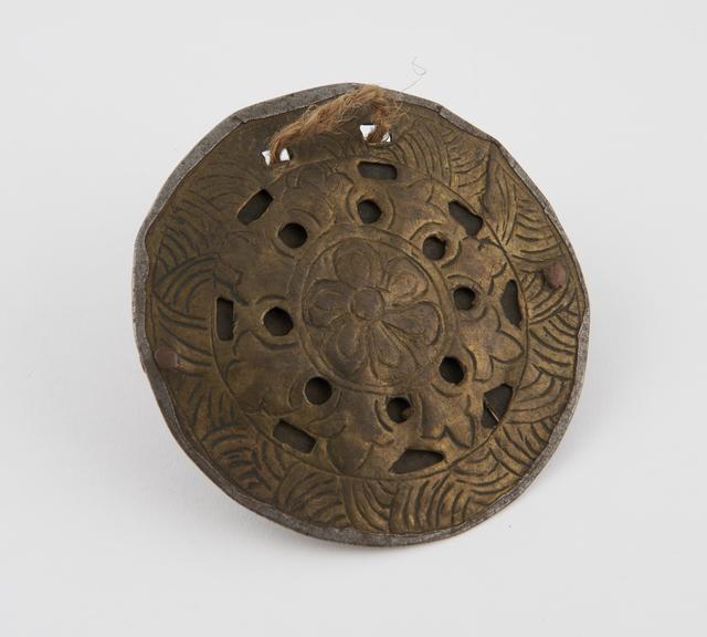 Circular brass anteel amulet with suspension holes and bar