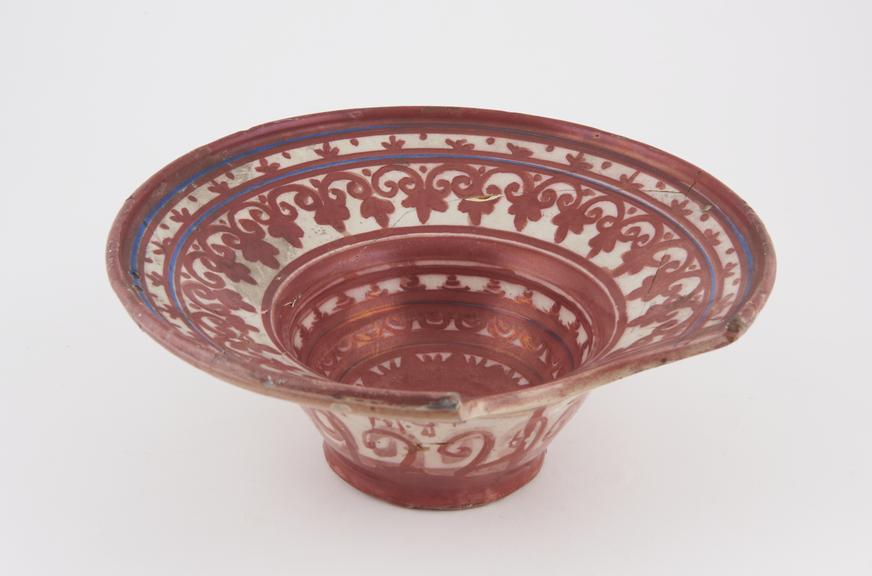 Barber's shaving bowl, lustred tin glazed earthenware