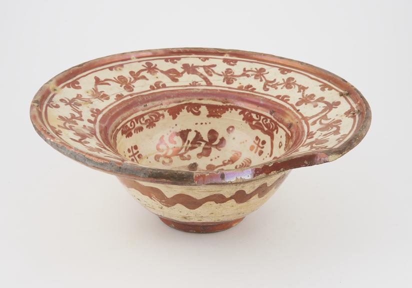 Barber's shaving bowl, lustred tin glazed earthenware, Manises