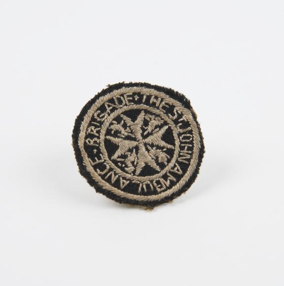 'The St John Ambulance Brigade' badge, material