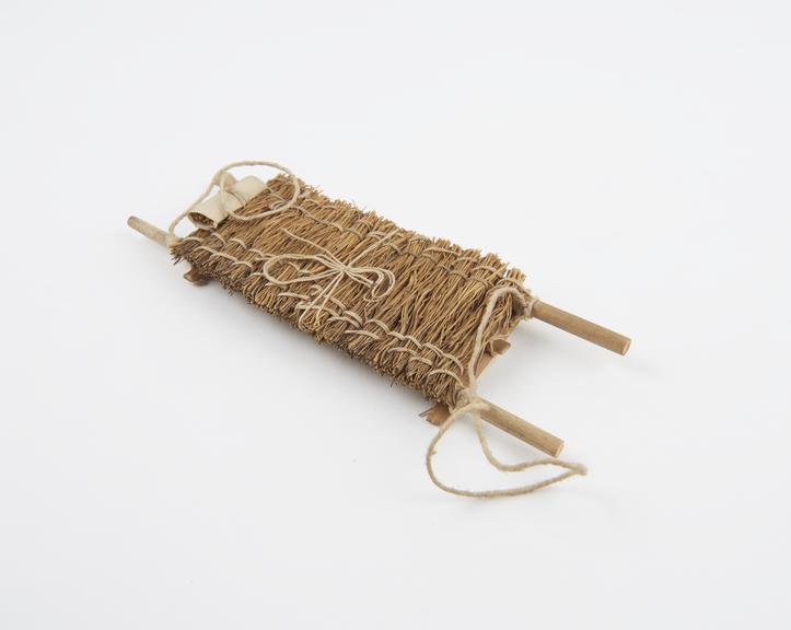 Model stretcher, cane, straw and string, reputedly Japanese