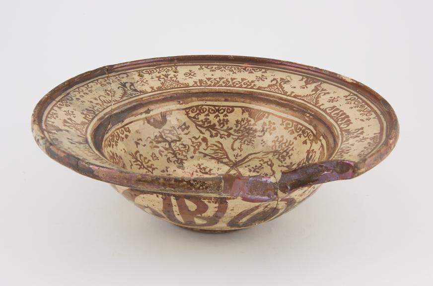 Barber's shaving bowl, lustred tin glazed earthenware, Manises