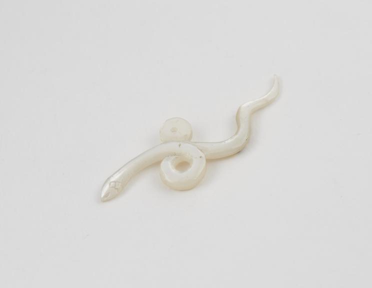 Pendant-amulet consisting of coiled serpent made of