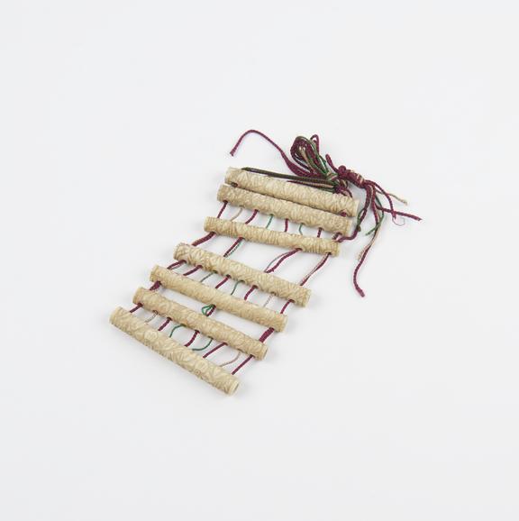 Ivory and thread toy, 1801-1900; possibly a puzzle