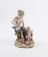 Porcelain figure group depicting a faun feeding her young with