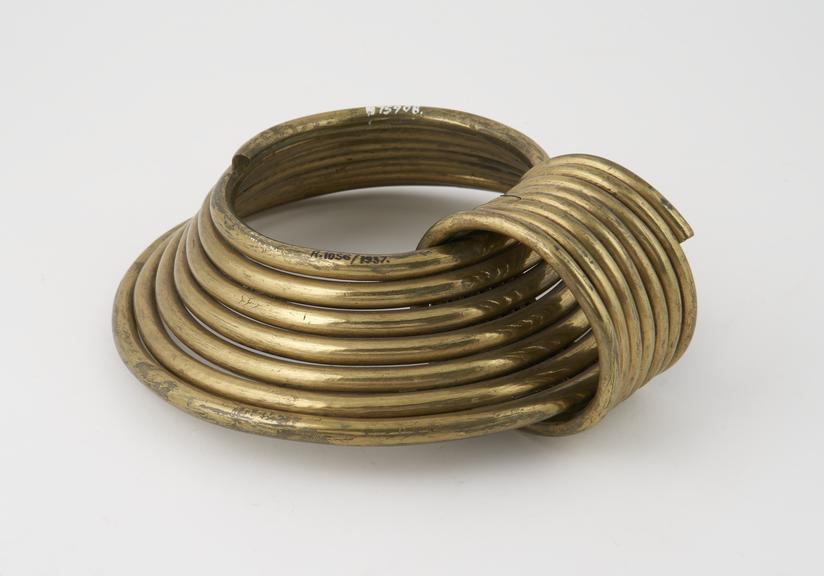 Coiled brass collar with second interlocking coiled ring across