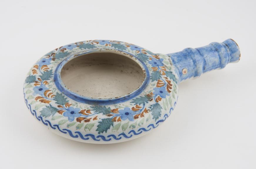 Tin glazed earthenware infant's bedpan, French, 18th century