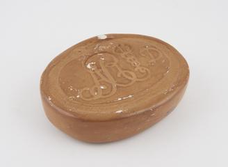 Soap punch with plaster bar showing impression