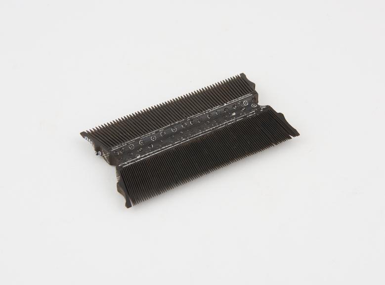 Wooden double comb, painted black, reputedly Portuguese