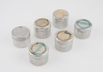 6 rolls of film in aluminium cannisters