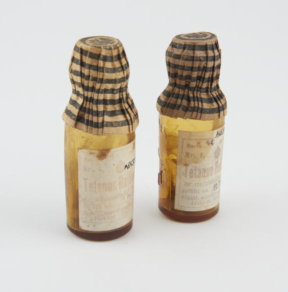 2 bottles, amber glass, for tetanus serum, with contents