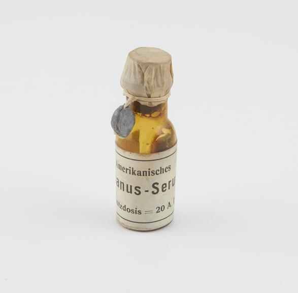 Bottle, amber glass, for tetanus serum, with contents, German