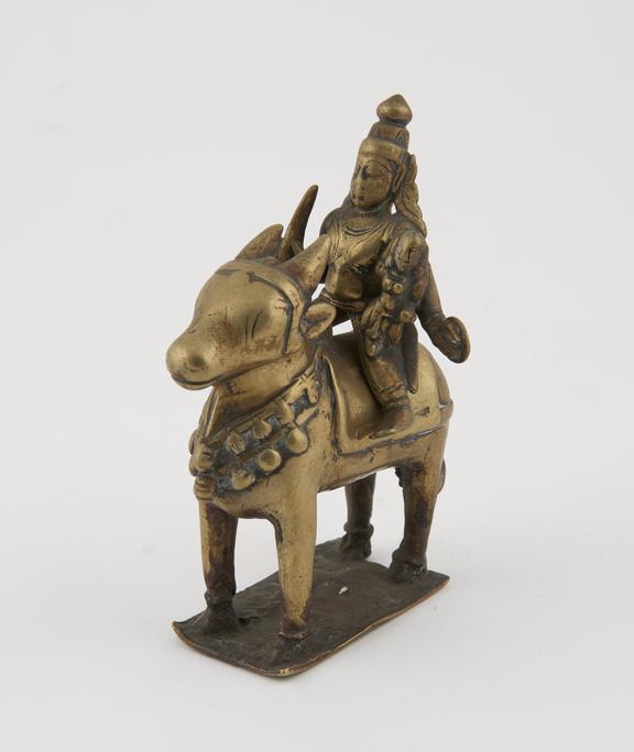 Brass statue of the hindu deities Siva and Parvati riding on