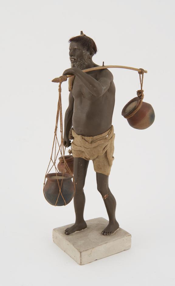 Painted plaster model of bearded man with pot