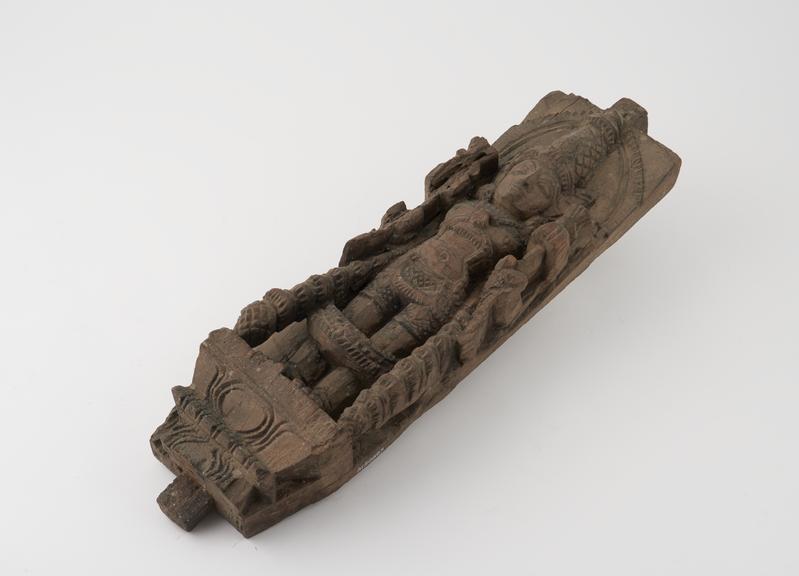 Carved wooden statue pillar of Parvati