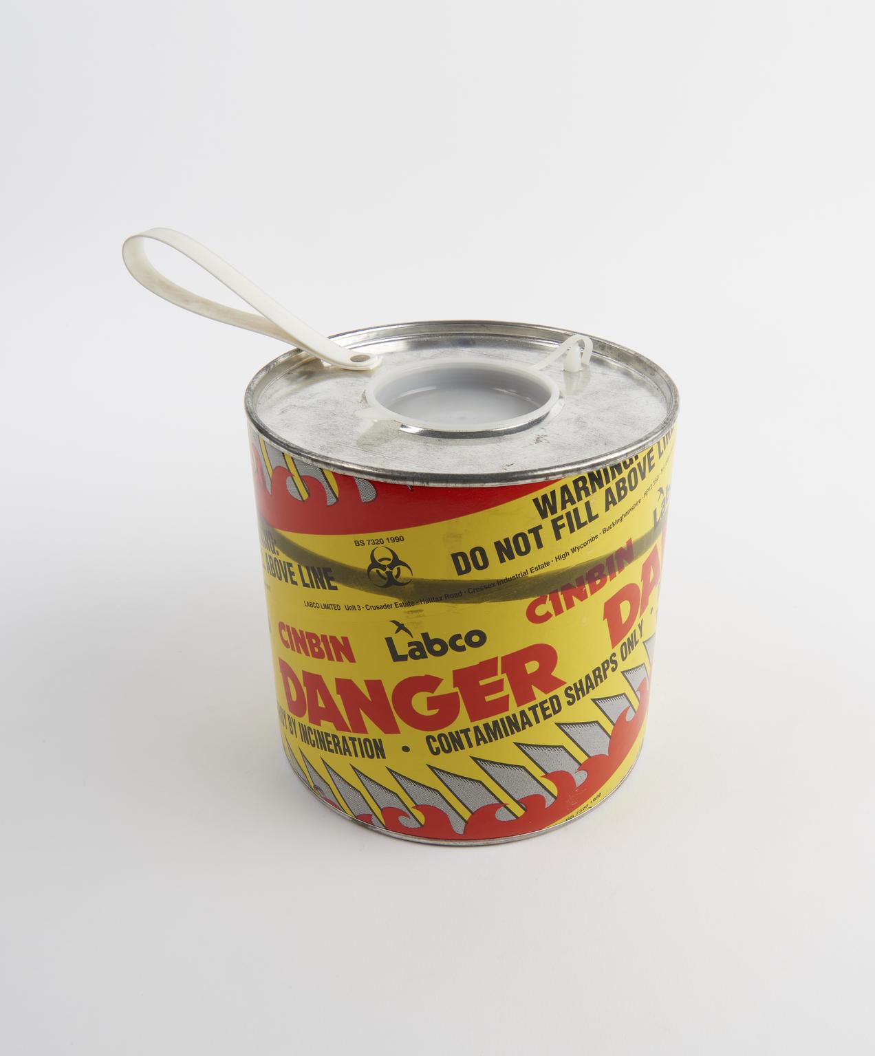 'Sharps' bin for safe disposal of needles, High Wycombe, England, 1994