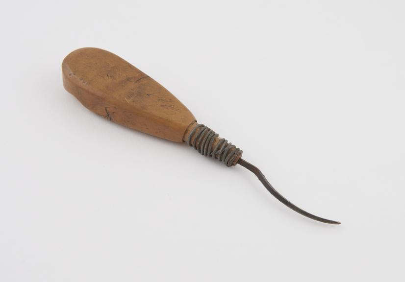 Curved steel spike with wooden handle, Algerian, 1701-1925