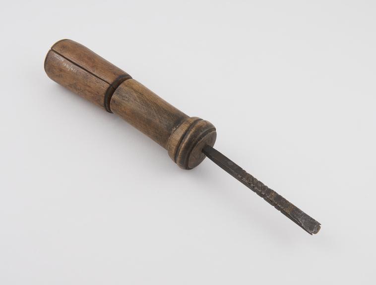 Iron drill with double cylindrical wooden handle, Algerian