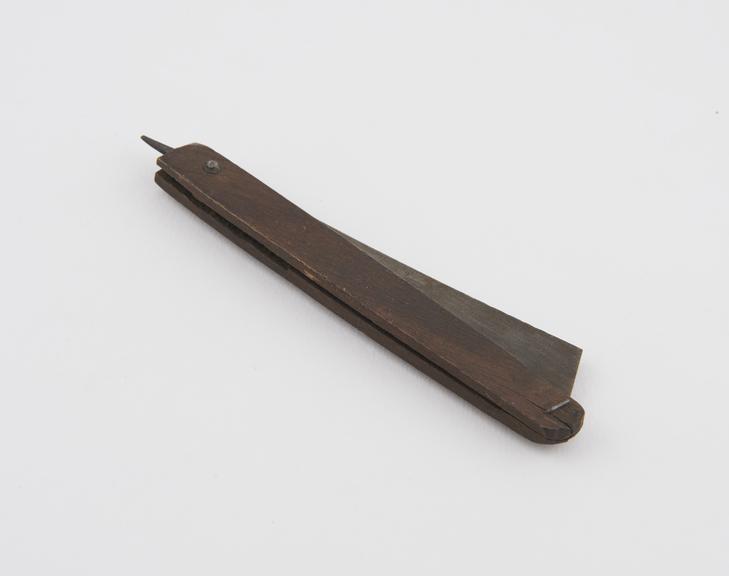 Copy of trephining razor, steel with wooden handle