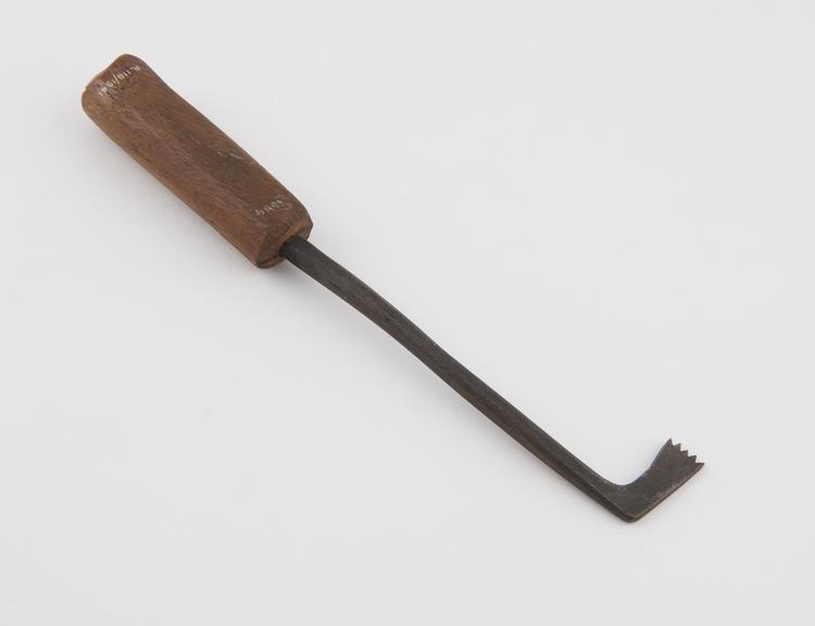 Copy of cranial trephining saw, steel, with wooden handle