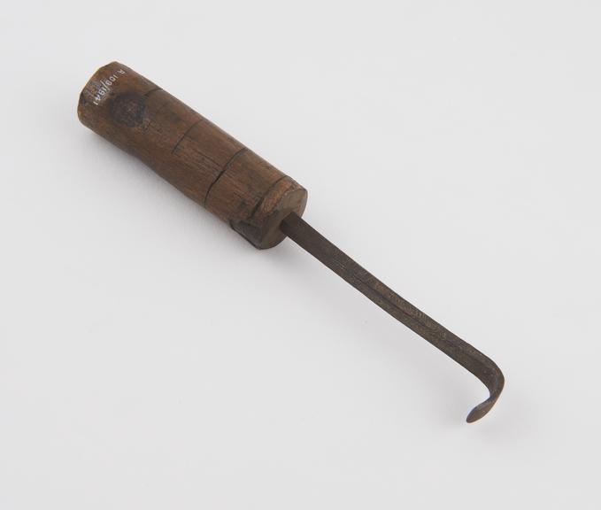 Copy of trephining elevator, iron, with wooden handle