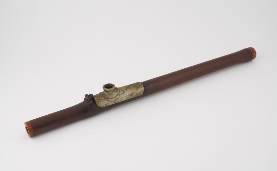 Bamboo opium pipe with ivory mounts at each end and metal plate