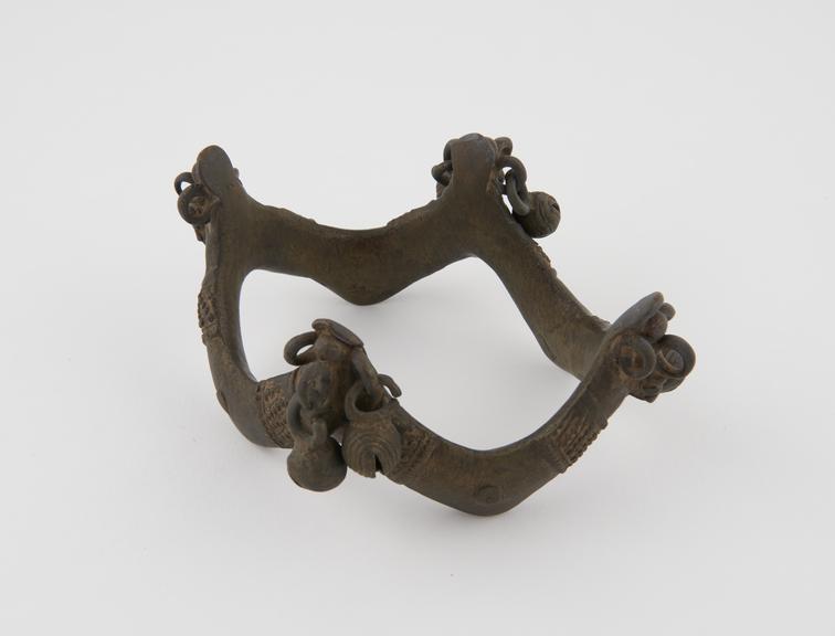 Bronze anklet, zigzag shaped, with clusters of pendant bells