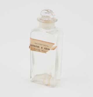 Glass bottle, labelled Truefitt's Quinine and Arnica Hair Wash