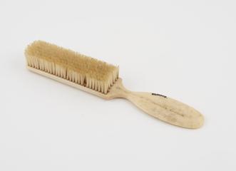 Small ivory hat brush with handle