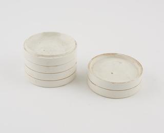 Six numbered white earthenware flat containers