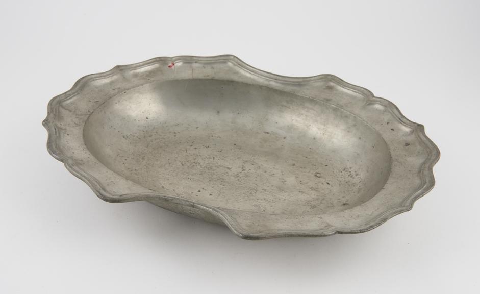 Barber's shaving bowl, pewter, oval-shaped