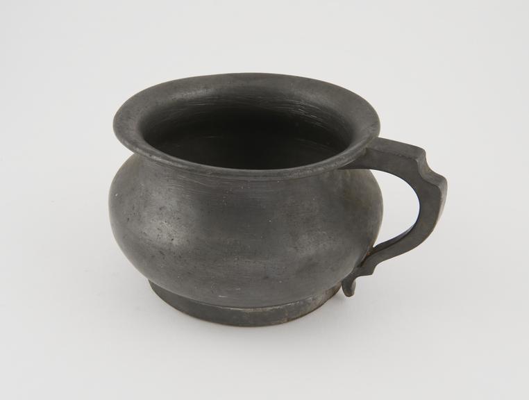 Child's pewter chamber pot with handle and flared rim, English