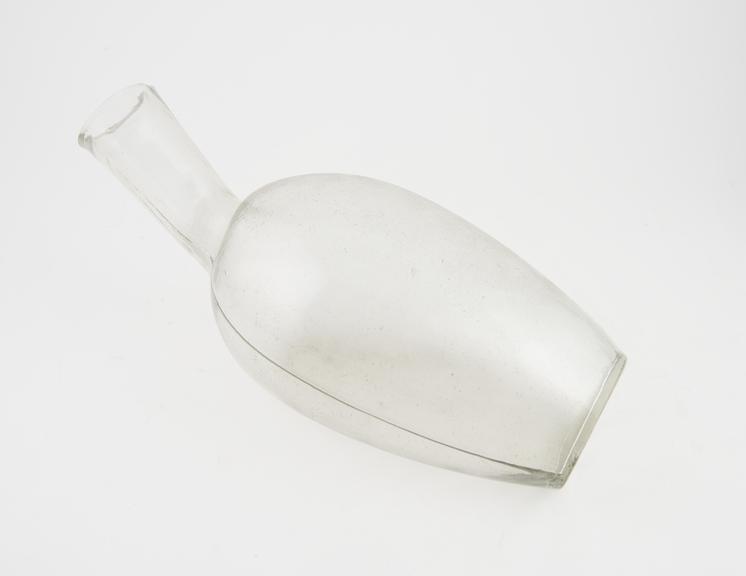 Large, glass, bottle shaped male urinal, English, 1850-1940