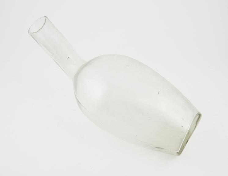 Large, glass, bottle-shaped male urinal, English, 1850-1940