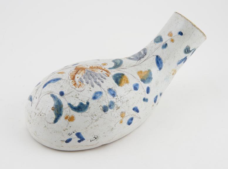 Earthenware bottle-shaped male urinal with polychrome