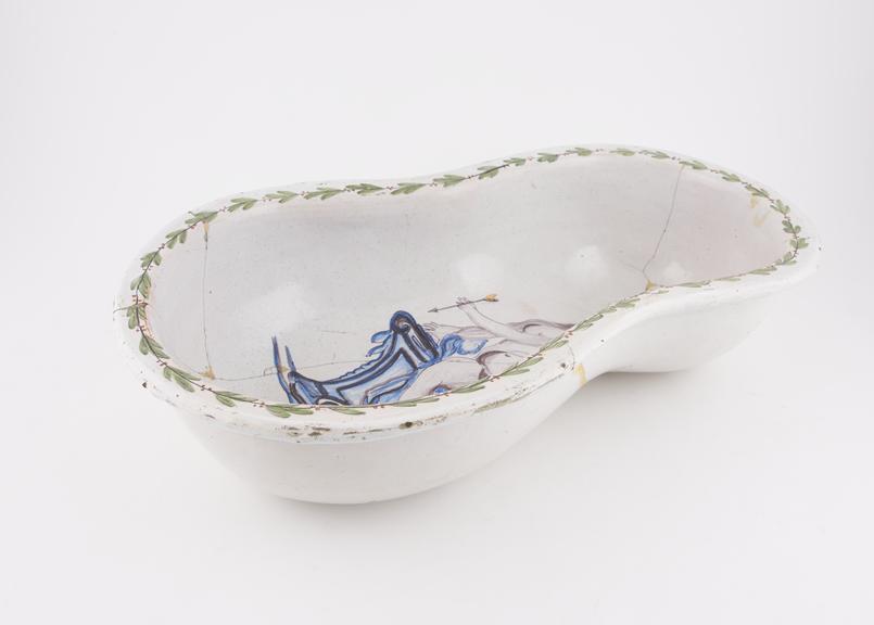 Tin glazed earthenware bidet pan decorated with reclining nude