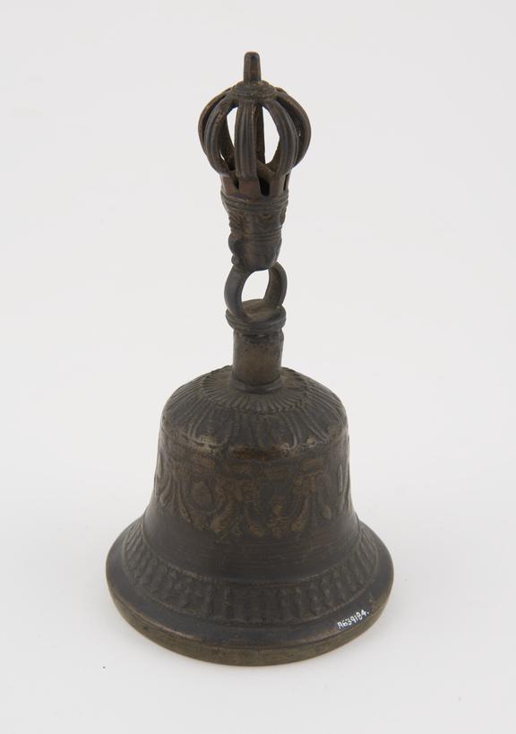 Brass ceremonial bell with handle surmounted by dorge