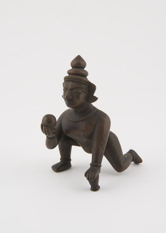 Brass figure of the hindu god Krishna as the butter thief