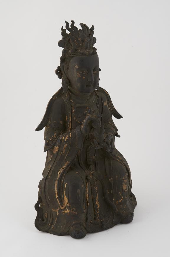 Hollow bronze statue of seated female goddess Kuan Yin