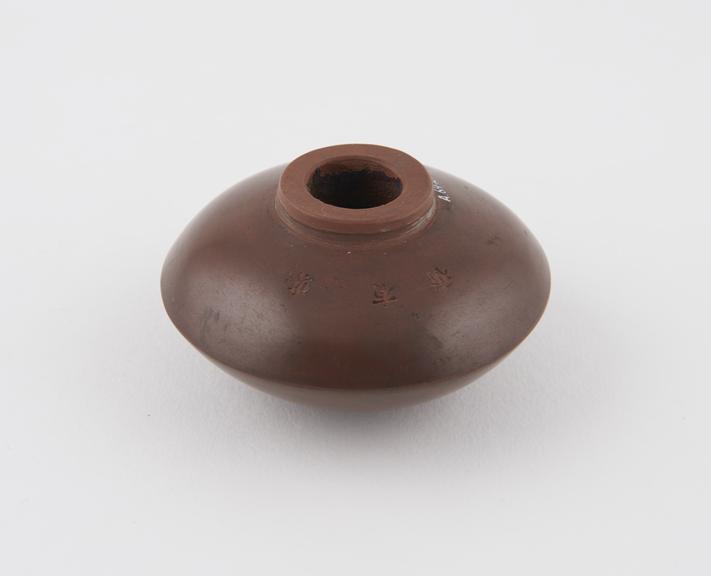 Pottery bowl from an opium pipe, disc shaped, probably Chinese