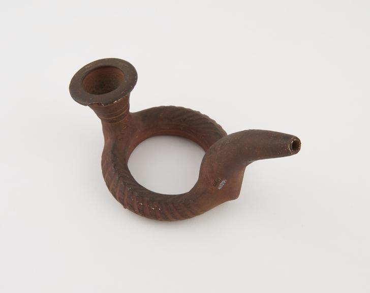 Red pottery tobacco pipe