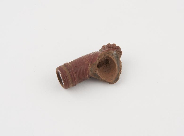 Pottery tobacco pipe bowl fragment with tubular stem socket