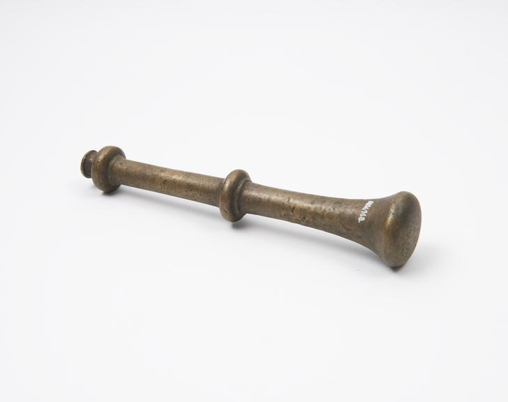 Bronze pestle, trumpet-like grinding end,disc and knob finial