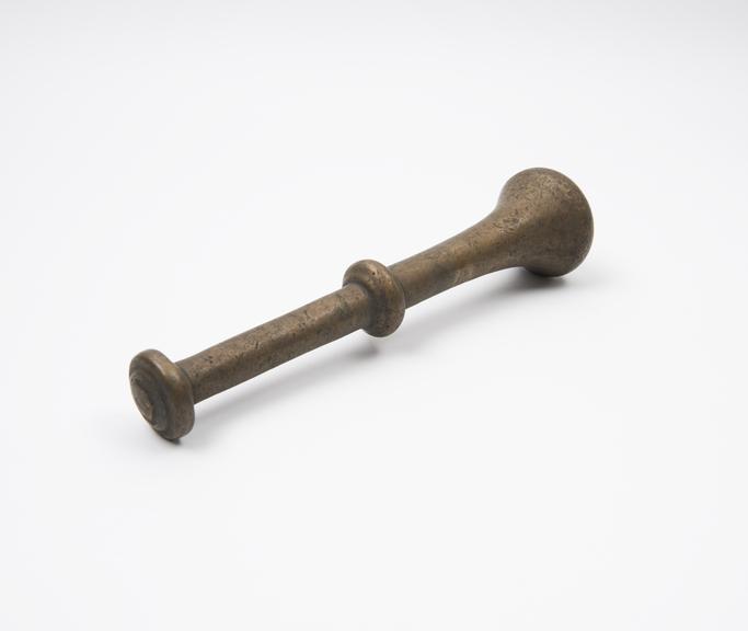 Bronze pestle with trumpet-like grinding end, circular finial