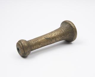 Brass pestle tapering to knop handle