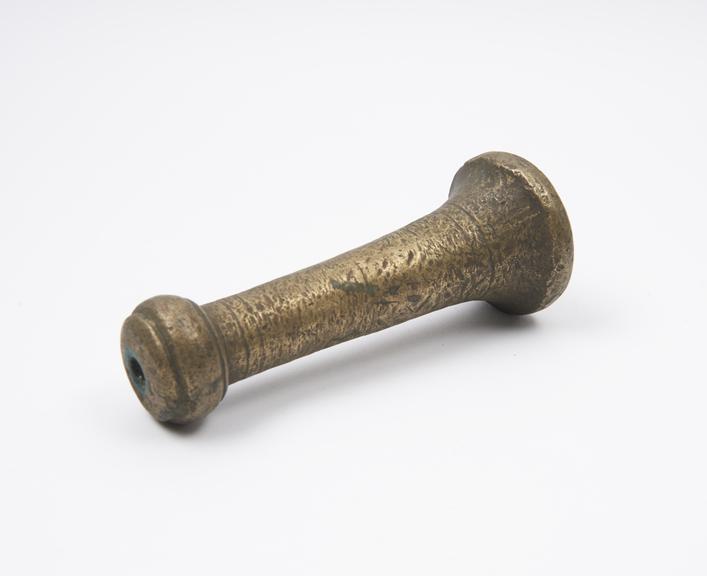 Brass pestle tapering to knop handle, part of finial missing