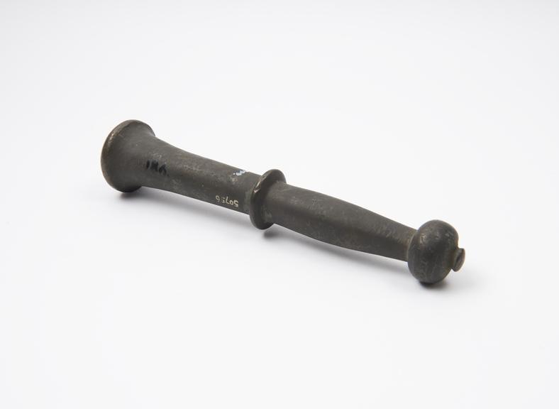Bronze pestle, trumpet-like grinding end, disc and knob finial