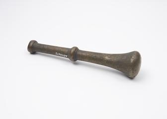 Bronze pestle with central flange and knob finial